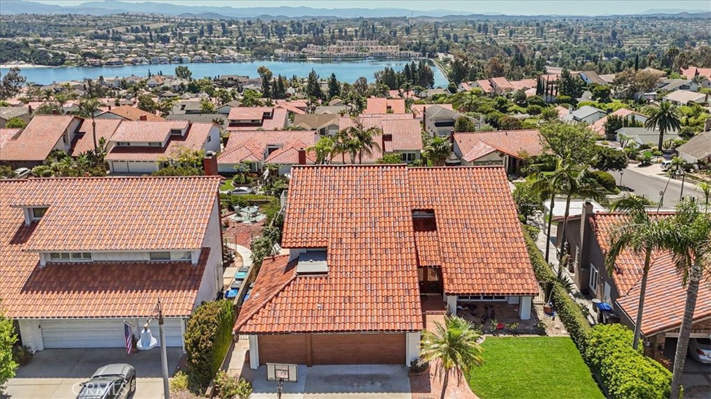 Situated on a premium lot above Lake Mission Viejo, this fully remodeled 5-bedroom, 3-bathroom home offers approximately 3,100 square feet of refined living space with panoramic lake views and resort-style amenities. The spacious layout includes both formal and casual living areas, a stunning kitchen that opens to the family room, and a main-level bedroom with full bath—ideal for guests or multigenerational living.
The interior has been completely updated with wide-plank wood flooring, sleek new cabinetry, marble countertops, and designer-selected finishes throughout. Upstairs, the primary suite features unobstructed lake views, a spa-quality bathroom, and generous closet space.
The backyard is perfect for entertaining, complete with a pool, spa, and patio. Located in one of Mission Viejo’s most desirable neighborhoods, with access to Lake Mission Viejo, top-rated schools, and convenient shopping and dining nearby.
Photographs to come.