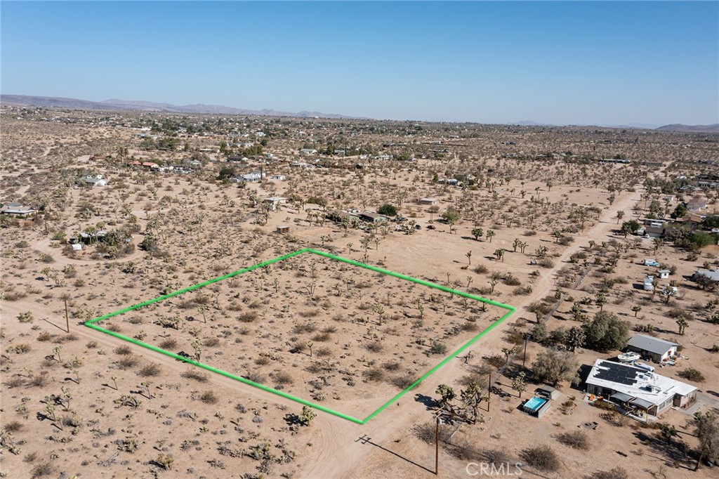 2-ACRE PARCEL, located in desirable, rural part of Yucca Valley, with views to the south of the mountain ridgeline in Joshua Tree National Park. Plans have been developed for this property have been developed to code, but at not presently approved. Water & Electricity nearby. Great location. Official street address has already been assigned to parcel to help expedite development and approval of building plans. NOTE: Green lines demarcating boundaries in pictures are approximate. APN: 0598-061-20