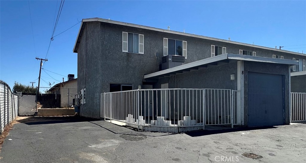 2 story 2 bedrooms and 2 baths up. Living room Kitchen, breakfast area & 1/2 bath downstairs Private gated front patio area. Single car garage with laundry hook ups in garage. Water & Trash Paid. No pets