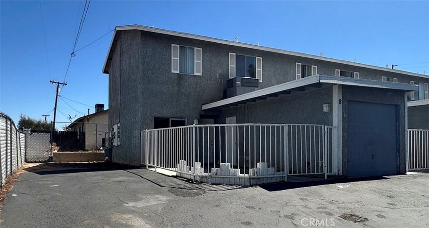 2 story  2 bedrooms  and 2 baths up. Living room Kitchen, breakfast area  & 1/2 bath downstairs Private gated front patio area. Single car garage with laundry hook ups in garage. Water & Trash Paid. No pets