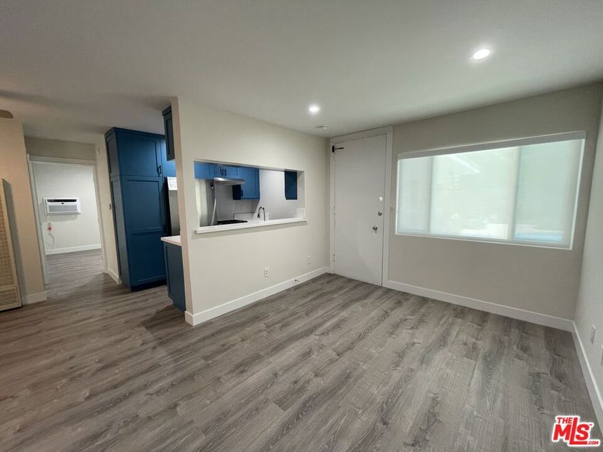 Incredible Marina Peninsula location on a coveted walk street, mere steps from the sand and vibrant Venice Beach.  This newly renovated 1-bedroom, 1-bath unit features a stunning kitchen with full-size, high-end stainless steel appliances and quartz countertops. You'll love the in-unit washer and dryer, conveniently located in a spacious laundry closet. Enjoy premium finishes throughout, including laminate wood flooring, air conditioning, and a generously sized bedroom. The pet-friendly complex (pet rent and deposit apply) also offers a refreshing pool for residents. A reserved, covered parking spot is included. Don't miss your chance to make this perfect coastal apartment your new home.