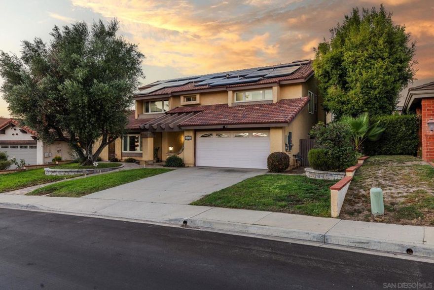 Welcome to this beautifully upgraded home in the highly desirable Montelena community of Rancho Bernardo. Featuring owned solar and two cozy fireplaces, this residence is filled with thoughtful details and modern comforts. The chef’s kitchen is a true centerpiece, boasting double ovens, stainless steel appliances, granite countertops, crisp white cabinetry, a cooktop, and a spacious island. Soaring 20-foot ceilings enhance the open feel, while multiple bonus spaces add versatility—including a second-floor loft and a ground-floor bonus room complete with a kitchenette and custom wine cellar. For movie nights at home, enjoy a built-in theater experience with a projector and custom-made screen in the living room.  The large primary suite offers vaulted ceilings, three closets, and a spa-like en-suite bath with a Jacuzzi tub. Additional highlights include spacious secondary bedrooms and a convenient main-floor bedroom and bath, perfect for guests or multigenerational living.  Step outside to an entertainer’s dream backyard, complete with a built-in fire pit, pergola, pavers, and turf for low-maintenance beauty. Nestled within the award-winning Poway Unified School District and close to shopping, dining, golf courses, Lake Hodges, and scenic trails, this home truly has it all.