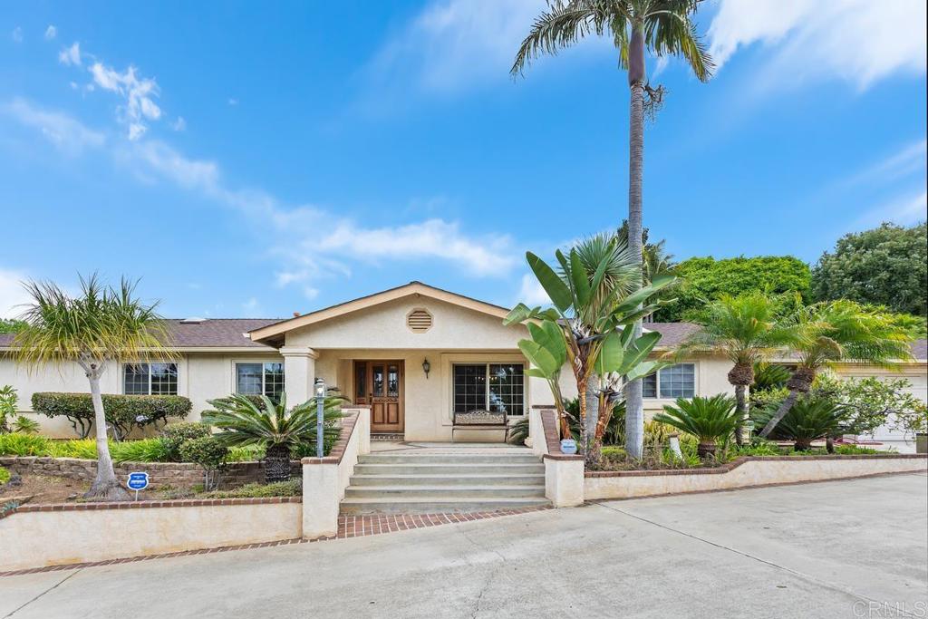 In a world of single-family homes built right on top of each other, this Ranch-style home in Old Carlsbad is a breath of fresh air! With 4 bedrooms, 2.5 baths, and plenty of room to spread out, you’ll love the flexibility of the floor plan—featuring a bonus formal living room with a fireplace, a separate dining room, and a dedicated laundry room. The bonus room can be anything you need it to be: a playroom, music room, home gym, yoga studio, craft space—you name it. Storage is no issue here, with hallway cabinetry, a walk-in closet in the primary suite, and custom cabinets in both the kitchen and laundry room offering tons of space. Set at the front of a shared driveway on a quiet cul-de-sac, the home sits back from the road, giving it a peaceful, private feel. The backyard is made for outdoor living with low-maintenance hardscaping, mature palms and succulents, garden space, and a built-in BBQ and kitchen area—perfect for entertaining. After a long day, retreat to the spacious primary suite, soak in the tub, or open the French doors to your private patio and let the ocean breeze drift in. The location is just as special—walk to Magnolia Elementary, Valley Middle School, and Carlsbad High. You're also just minutes from the 5 freeway, El Camino Real corridor, grocery stores, gas stations, restaurants, Starbucks, and only one mile to Carlsbad State Beach!