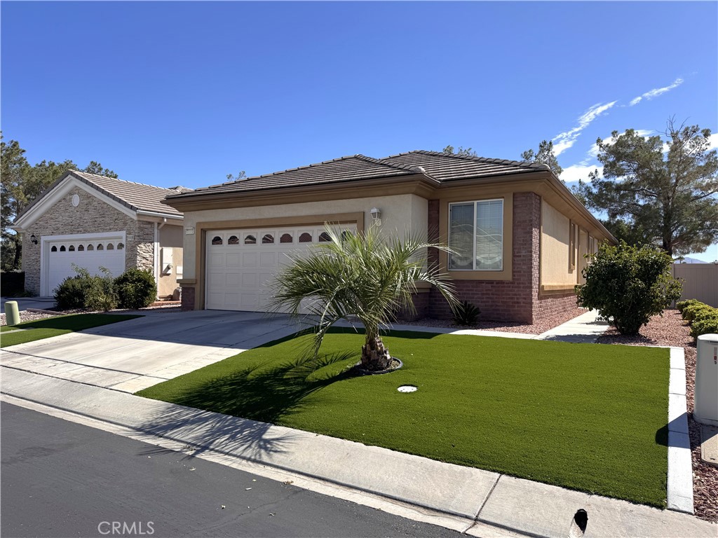Beautiful Home in Gated 55+ Community – Sun City Del Webb. Welcome to this charming and meticulously maintained 2-bedroom, (a den that could be 3rd bedroom), 2-bathroom home in the highly desirable Sun City Del Webb, a premier 55+ gated community in San Bernardino County. Offering comfort, convenience, and an active lifestyle, this residence is perfect for those seeking a peaceful yet vibrant environment. Enjoy a functional floor plan with a spacious den/office, indoor laundry room, and tile flooring in the kitchen, entryway, and baths. The primary suite features a private bathroom with a walk-in shower, and the kitchen boasts oak cabinets and Corian counter tops .Located near Ashwood Golf Course , residents also enjoy resort-style amenities:Two clubhouses (Aspen & Mariposa) Fitness center, indoor/outdoor pools, spas, walking trails, pickleball courts, and more. This little charmer is located on a quiet -cul-de-sac and everything you need is minutes away; Cinemark movie theater, Target, restaurants of all kinds , Stater Bros grocery store , Home Depot , Lowes Home Improvement ,Victor Valley Community College , and Mojave Narrows Regional Park.