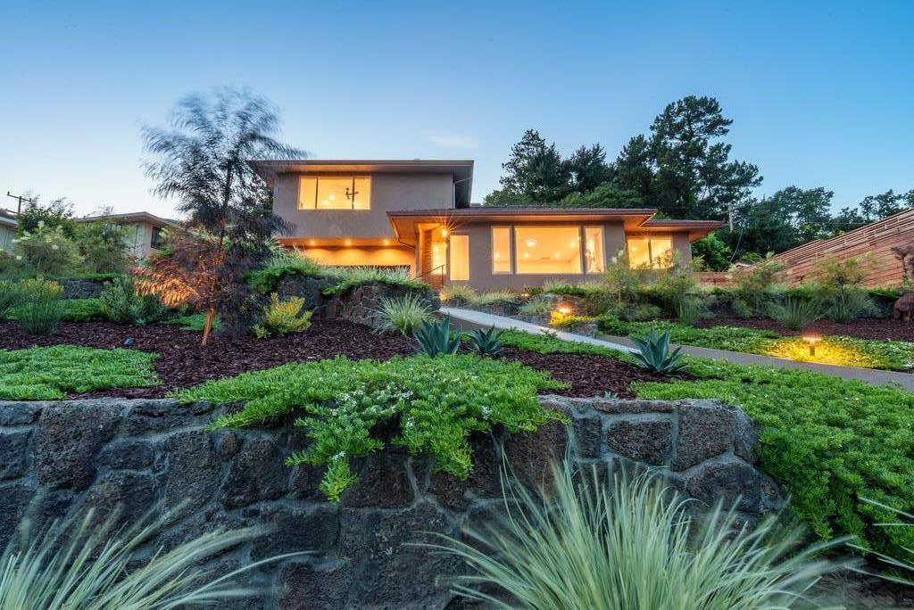 Step into a world of refined living, where sweeping ocean views and meticulous upgrades set a sophisticated stage on Santa Cruz's coveted Westside. As sunlight dances across wide-plank European oak floors, every space reveals luxurious touches, from the chef's kitchen with dual-fuel range with split oven, quartz counters, and custom cabinetry, to a remodeled sunken family room aglow with diffused art lighting. Slide open to the ocean view deck, perfect for evening gatherings around the outdoor kitchen, with modern landscaping and lighting elevating outdoor entertaining. The primary suite wows with panoramic vistas, dual walk-in closets, and automation for sunset shades and heated floors. Imagine a seamless blend of indoor-outdoor living, steps from legendary surf, coffee houses, and wine bars. Owned solar, EV charging, and smart features ensure comfort and convenience at every turn. This turn-key residence invites you to experience coastal elegance and contemporary luxury beyond the expected.