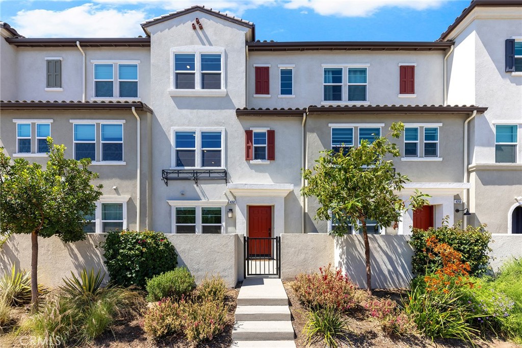 Welcome to this contemporary and energy-efficient tri-level townhome located in the coveted Lotus Arcadia community. This stylish residence features 4 bedrooms and 3.5 bathrooms, offering both comfort and functionality for today’s lifestyle. The entry-level includes a private ensuite bedroom—perfect for in-laws, guests, or a home office—plus direct access to the attached two-car garage. The main living level showcases an open floorplan with abundant natural light, a spacious living and dining area, and a modern kitchen equipped with a large island, walk-in pantry, and guest powder room. Upstairs, the top level features a generous primary suite with walk-in closet, two secondary bedrooms, a full hallway bath, and a conveniently located laundry room. Additional highlights include a fully paid-off solar system and furnishings included with the sale, offering a truly move-in ready opportunity. Enjoy thoughtfully maintained community grounds and an unbeatable location near the Metro Gold Line, 210 & 605 freeways, Santa Anita Mall, parks, and popular dining spots.