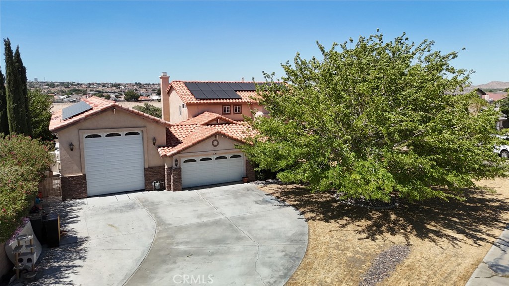 Stunning pool home with 1,200 Sq.Ft. RV Garage Overlooking the Mojave River! This extraordinary property is built for living and entertaining! Tucked away at the end of a quiet cul-de-sac, this private oasis boasts panoramic views of the Mojave River, a sparkling pool with Baja shelf, and an impressive 1,200 sq.ft. RV garage—complete with a bonus room and elevated deck to take in the scenery. With five spacious bedrooms, this home offers the flexibility you need—whether for family, guests, or a home office. You'll love the elegant formal living and dining areas, plus a separate family room with cozy fireplace. The chef’s kitchen is outfitted with sleek granite counters and opens up for effortless hosting. Additional features include custom tile work with granite inlays to designer bathroom finishes. Lighted ceiling fans in every bedroom. The backyard is a dream: multiple patio spaces, a built-in BBQ, and a half-court concrete pad ideal for dining al fresco, riding scooters, or extra entertainment space. The pool & spa area is separately gated for peace of mind. Love your toys? You’ll have room for them all in the massive RV garage, featuring wall-to-wall cabinetry and an upstairs bonus room with stunning views. All of this—without the burden of HOA fees—just outside the prestigious Stonebrook Estates and moments from major shopping, services, and home improvement stores. This is a rare find at a great value you won’t want to miss.
