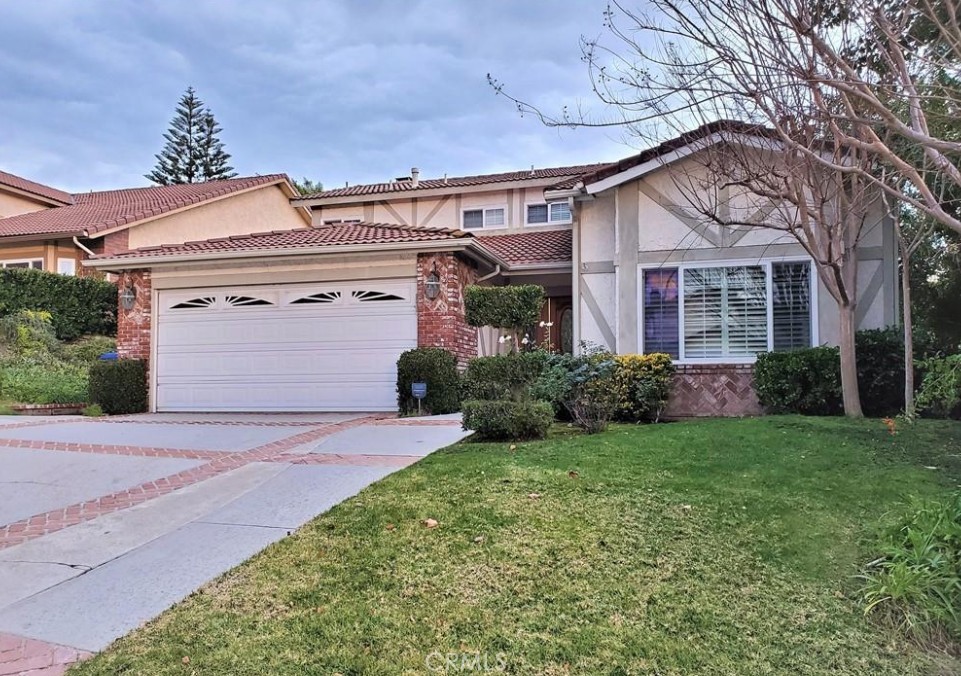 This beautiful two-story home in the heart of Agoura Hills offers and open Formal Living Room and Dining Room with hardwood floors and cathedral ceilings. These two lead into the separate Family Room and eat-in Kitchen with granite counters and Travertine floors. Upstairs you will find a large master ensuite as well as a double-sized secondary room and third bedroom with an additional bathroom. Neutral tones and stone throughout along with a large back yard provide ample space. Award-winning school district and houses of worship along with parks and shopping make this the ideal location for all your needs.