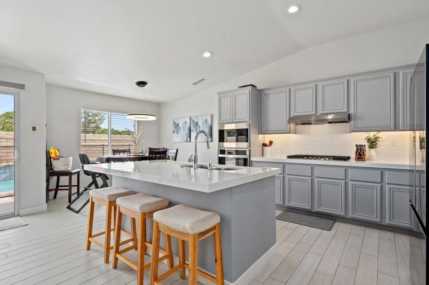 Upgraded, Smart, and Ready to Impress - This beautifully and tastefully updated 4-bedroom, 2.5 bath home is in the highly sought-after gated community of Starlight Dunes and boasts an open-concept floor plan with 10+ ft high ceilings. Nestled on a quiet cul-de-sac this 2,376 sq ft single-story retreat combines thoughtful upgrades, modern tech, and an incredible outdoor living space. The family room and dining room are open to the kitchen with a large eating area that can comfortably accommodate formal gatherings of family and friends. Outside you will find a large covered outdoor space boasting a double insulated covered patio with recessed lighting, fan and 55'' Outdoor TV. With peek-a-boo mountain views, a low maintenance yard, and a fully fenced-in pool and spa. The high-ticket items have been done for you and move in ready. Recent major improvements include: New A/C units, new spa heater, new water heater, epoxy garage floor, garage storage shelves, workbench, and tool boxes, Ecobee smart thermostats (Dual zones), programmable recessed lighting throughout, and Ring cameras installed. This home is fully equipped with $40K+ in included tech and essential mechanical updates. The primary bedroom has a wall mounted 64'' TV and Soundbar, both of which stay for your enjoyment. Conveniently  Located near IB league schools, upscale dining, shopping and El Paseo - the Rodeo Drive of Desert shopping. And with 100+ golf courses in the area, you are guaranteed a tee time. This home offers everything you could possibly need to start enjoying a true desert experience from the moment you walk through the door. Whether you're looking for a desert retreat or a full-time residence, Zenith Way delivers the total package.