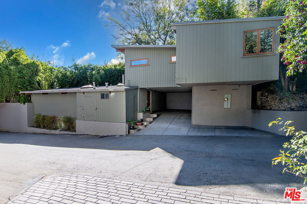 Amazing Mid-Century style and quintessential Beverly Glen living available for lease. This furnished 2bd/2ba home is a one-of-a-kind and and is filled with style as it full embraces the indoor/outdoor lifestyle. Split between two levels. Amidst an abundance of natural light and with beautiful wood floors throughout, the top level features an open, spacious kitchen, a window-filled living room with fireplace and separate space for dining and office. Directly off the living room is a private deck perfect for entertaining or relaxing. Downstairs are 2 bedrooms and 2 designer bathrooms. The primary bedroom opens nicely to its own private outdoor area where you could arrange additional meditation space or even exercise your green thumb. Quito Lane is a hidden gem, revered by its inhabitants, and enjoying a step away from Beverly Glen Blvd itself. One car carport along with another partially covered space outdoors. 10410 Quito Lane provides the an awesome feeling of escape from the city while still being close to all the action.