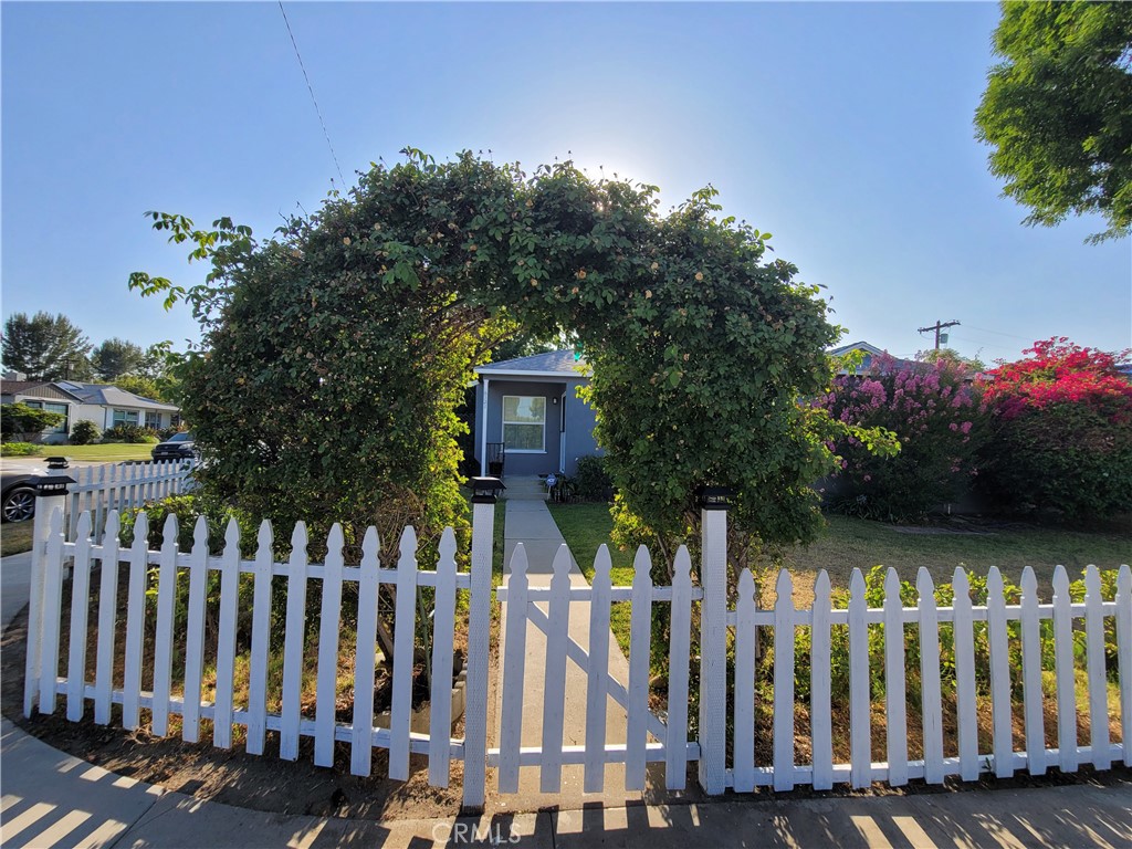 Charming Artsy Cottage on White Oak Peninsula
Tucked away behind the island on the desirable White Oak Peninsula, this artsy-chic cottage blends classic charm with modern updates. A white picket fence welcomes you to a spacious front yard and a cozy front porch—ideal for enjoying the peaceful surroundings. Inside, a large picture window fills the living room with natural light, highlighting the beautiful hardwood floors and smooth ceilings. The inviting dining area leads to a thoughtfully designed kitchen featuring stainless steel countertops, ample cabinetry, and a sunny breakfast nook. Two newly remodeled full bathrooms showcase tasteful design and stylish touches throughout. An indoor laundry room adds convenience, while central AC and heat ensure year-round comfort. Step out back to a private yard with a large custom wooden deck shaded by mature trees—perfect for entertaining or relaxing. A detached 2-car garage offers additional space and storage. Located in prime Encino, just minutes from Ventura Boulevards' vibrant restaurants, boutiques, and easy freeway access. Zoned for the highly-rated Emelita Elementary School. A truly unique and inviting home!