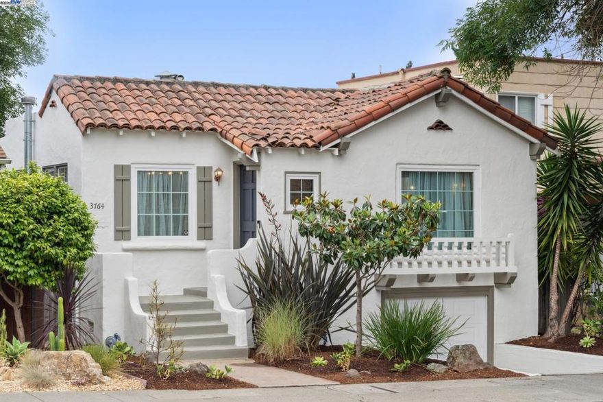 With a huge backyard oasis and the lively Laurel District just blocks away, this beautifully upgraded 2+BD/1BA Mediterranean home, complete with a full basement, offers an easy California lifestyle in the heart of the city. The enchanting 1232 SQFT home enjoys fine architectural details and lives large, with lovely indoor/outdoor living. This oversized outdoor oasis features a large pergola and deck, patio with fire pit, and expansive space ready for your imagination or potential ADU. Relax in the living room in front of the vintage fireplace while sun streams from multi-pane windows. Beautiful hardwood floors flow through a graceful arch and into the dining room. The adjacent eat-in kitchen has been stylishly renovated with new appliances, cabinets, and countertops. Drink your morning coffee in the sunny breakfast nook, or step out back to dine al fresco, unwind, garden, or play with family and friends. Two bright bedrooms share a full bath. One bedroom features a backyard view, while the primary suite offers two roomy closets and a great office space behind French doors. The lower level includes a laundry area, interior access to the 1-car garage, and an exterior basement entry. Out your front door, enjoy dining, shopping, gyms, and easy commuter access.