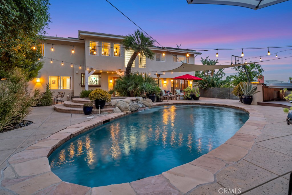 Tucked away at the top of a quiet cul-de-sac and within the coveted Las Virgenes School district is West Hills’ highly sought-after Knapp Ranch community. This beautifully updated 5-bedroom, 3-bathroom home, offers the ideal balance of style, space, and serenity. With 3,116 sq. ft. of living space on a generous ¼-acre lot, this residence is thoughtfully designed for both relaxed everyday living and effortless entertaining. At the heart of the home is a magazine-worthy chef’s kitchen, showcasing a custom island, elegant Quartzite countertops, stainless steel appliances, and a built-in bar—perfect for gathering with friends and family. The open floor plan flows seamlessly into light-filled dining and living areas, creating a spacious and inviting atmosphere throughout. Upstairs, you'll find four spacious bedrooms, including a luxurious primary suite complete with a private sunroom and sweeping views of the Valley. A convenient en-suite bedroom is located downstairs—ideal for guests, or a home office. Smart, dual-zoned Nest thermostats provide energy saving comfort to any level of living space. Step outside and escape to your own resort-style backyard featuring a sparkling pool and spa, built-in outdoor kitchen, and expansive decking with gorgeous views of the Valley. With only one neighboring home on the west side, new ultra-quiet Chamberlain garage doors, and a whole-house Ring system in place, the exterior space offers exceptional privacy, peace and safety. Additional highlights include: a 3 car garage wired for electric vehicle charging, paid-off solar, Las Virgenes daily pickup/drop-off, plus close proximity to trails, shopping, and Knapp Ranch Park. Come view this property and experience a true community in the heart of West Hills!