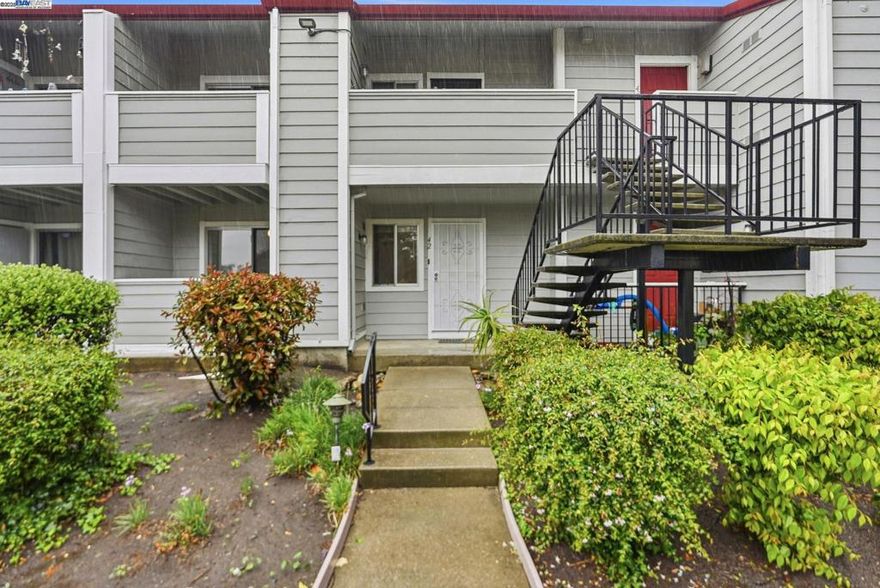 Beautiful first floor, bottom level unit in a quiet and well maintained community. This 1 bed 1 bath home features laminate flooring throughout and rare in-unit washer and dryer. Enjoy two private balconies-one in the front and one in the back perfect for fresh air, plants or relaxing outdoors. The unit includes a detached garage for parking and additional storage. Prime location close to major freeways, BART, and public transportation, making commuting a breeze.