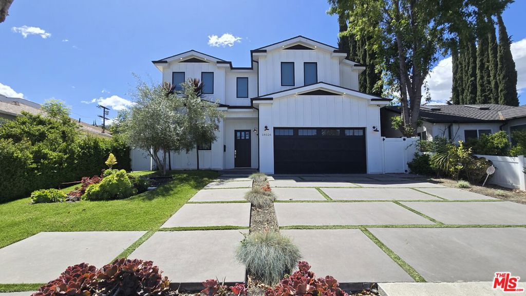 Welcome to your private oasis in prime Encino where timeless style meets resort-caliber living. This exceptional modern farmhouse blends warmth and sophistication, offering designer details and premium amenities that cater to the most discerning renters. Step into 5 spacious bedrooms and 4.5 elegant baths, thoughtfully designed for comfort, functionality, and style. The heart of the home is a stunning chef's kitchen featuring quartz countertops, custom cabinetry and sleek Thermador appliances. An open flow connects the kitchen to the light-filled living room with a statement fireplace, wine closet display, and formal dining area all overlooking a tranquil backyard sanctuary. Soaring ceilings, oversized doors, and expansive windows create an airy, gallery-like ambiance throughout. The luxurious primary suite is a retreat unto itself with vaulted beamed ceilings, dual walk-in closets, its own fireplace, private balcony, and spa-style en-suite bath complete with soaking tub, walk-in shower, double vanities, and a makeup station. This home is wired for sound and security, and features motorized window shades for added convenience and luxury. Outdoor living takes center stage with a sparkling pool, cascading spa, and a detached cabana with its own bathroom and fireplace - ideal for guests, work-from-home, or peaceful relaxation. Dine alfresco under the stars with a built-in BBQ and lounge across multiple entertaining zones framed by lush landscaping and ultimate privacy. Located south of Ventura Boulevard in a highly sought-after pocket of Encino, this home offers seamless access to the 101 & 405 freeways, and is mere minutes from top restaurants, boutique shopping, premium groceries, and entertainment hubs. Whether you're looking to retreat in style or live boldly in the heart of the Valley's best, this fully appointed home delivers luxury, location, and livability in one perfect package.