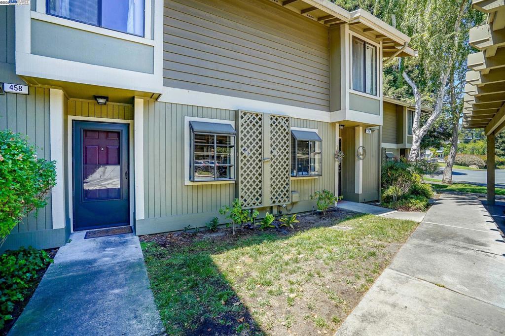 Step into this beautifully updated Eastgate townhome-style condo, where comfort meets style in every corner! With 2 spacious bedrooms — one with its own private balcony — and 1.5 baths, you’ll love the smart use of its 1,088 sq ft layout. The modern kitchen shines with stone countertops, stainless steel appliances, a cozy breakfast bar, and a sunny garden window. Enjoy the open-concept living and dining area, complete with a charming fireplace and a slider that opens to your own private patio nestled under redwood trees with no neighbors behind. Plank flooring, central heat and air, plus a stackable washer/dryer add everyday ease, while double-wide bedroom closets and extra storage keep life organized. Relax by the community pool or clubhouse, with HOA perks like water, trash, landscape and building upkeep included. With two parking spots, guest parking, and a prime spot near parks, trails, downtown Martinez hotspots, and quick freeway access — this Eastgate condo is ready to welcome you home! Seller will consider concessions to buyer for 50% of 1 year of HOA dues.