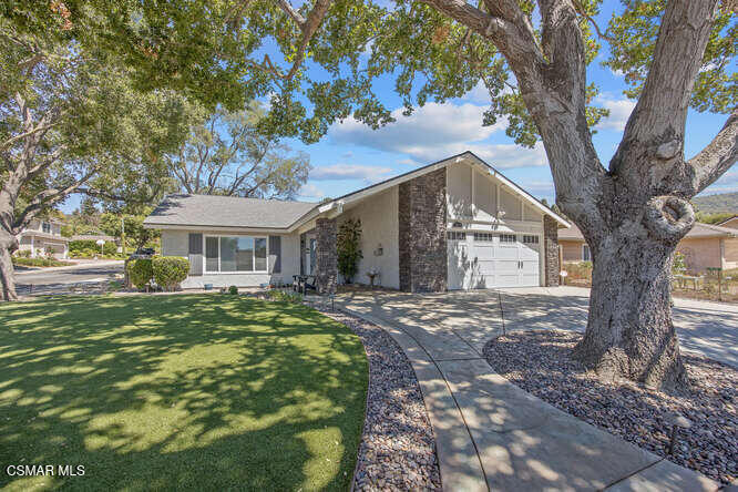 Cute house tucked in the Shadow Hills tract of Newbury Park! Many recent upgrades make this move-in ready for the buyer. Gorgeous curb appeal under the oak trees! New concrete driveway and walkways, new front turf, pretty entryway. Newer roof, new exterior paint, new stone veneer, newer windows. Step inside to maple wood and tile floors. The cute kitchen was done a few years back. Newer white cabinetry, granite countertops, and an accent glass tile splash. Cozy eat-in kitchen with custom fireplace. Pretty covered patios out back will delight your friends as you entertain. Ample lawn space, and concrete planters to add your own landscapes. 3 good-sized bedrooms. Hall bathroom has recent updates. Newer HVAC system, A/C, furnace, ducts. Welcome home!