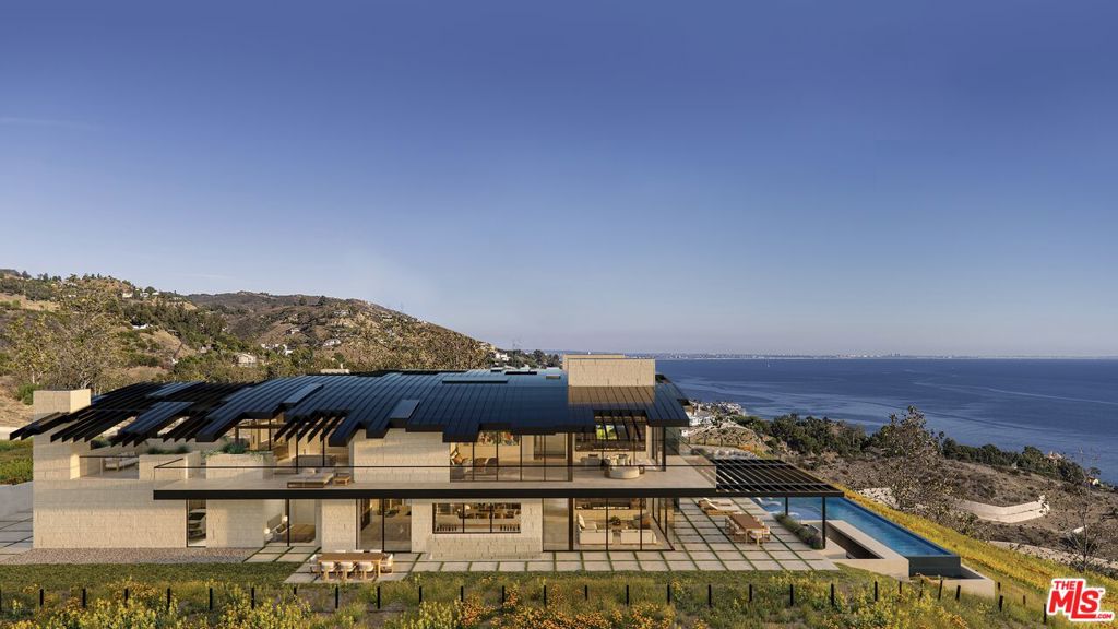 Welcome to Villa Paradiso. The epitome of coastal luxury living in the prestigious Carbon Beach Terrace Estates, where breathtaking ocean views meet unparalleled elegance. Nestled in the coveted enclave of Malibu's famed Billionaire's Beach, this exclusive estate offers an unrivaled opportunity to create your dream home on a pristine canvas of approximately 29 acres. Boasting unobstructed 360-degree views of the sparkling Pacific Ocean and coastline, this prime parcel is a rare gem awaiting your vision. Majestic gates beckon you into a world of serenity and sophistication, where approved city plans and permits are in place for an exquisite contemporary architectural masterpiece designed by renowned architect Jay Vanos. Spanning approximately 13,355 square feet, this visionary design seamlessly blends indoor and outdoor living, with expansive entertainment spaces and luxurious amenities to satisfy even the most discerning tastes. Imagine indulging in a world-class wine cellar, entertaining guests in the seated bar and game room, or unwinding in the home theater and piano bar. For the wellness enthusiast, a fully-equipped gym and sauna/steam room offer the perfect retreat, while outdoor amenities abound with an infinity pool, jacuzzi, pizza oven, and built-in BBQ. Whether lounging in the sunken seating area or enjoying cocktails at the swim-up bar, every moment is imbued with the essence of luxury living. Includes deeded access to the prestigious La Costa Beach & Tennis Club. With convenient proximity to Pacific Coast Highway and Malibu's renowned dining, shopping, and entertainment destinations, this double gated gem is truly an opportunity not to be missed. Available to be sold as a package.