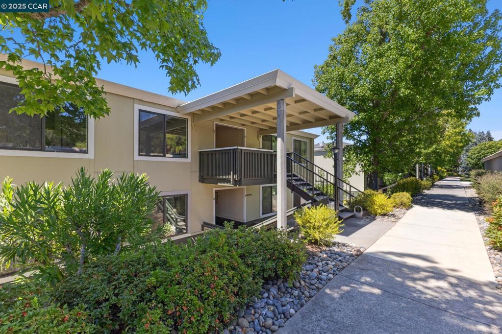 The Walke Inn is a beautifully reimagined, fully renovated home designed for both elegance and comfort in the heart of Rossmoor’s 55+ community. Expertly updated by Fred Rooster Renovations, this Sonoma model features thoughtful design and modern touches throughout. At the heart of the home is an inviting open concept kitchen with a large island with seating, oversized farmhouse sink, induction range with pot filler, quartz countertops, and a full-sized pantry closet for ample storage. Milgard dual-pane windows and a large rear patio door flood the space with natural light, while high-end finishes create a warm, upscale feel. The primary suite boasts an expansive layout featuring a massive walk-in closet and a luxurious en-suite bath with a retiree friendly curbless walk-in shower. A second full bathroom includes another walk-in shower with built-in seat. Additional features include in-unit full-sized laundry, a front door smart lock, and a layout ready for a minimalist lifestyle. Step outside to enjoy the huge balcony—perfect for relaxing or entertaining. From stylish finishes to smart upgrades, every detail has been considered. Ask your agent about the Tailor to Your Taste™ allowance program and add your personal touches to this home.
