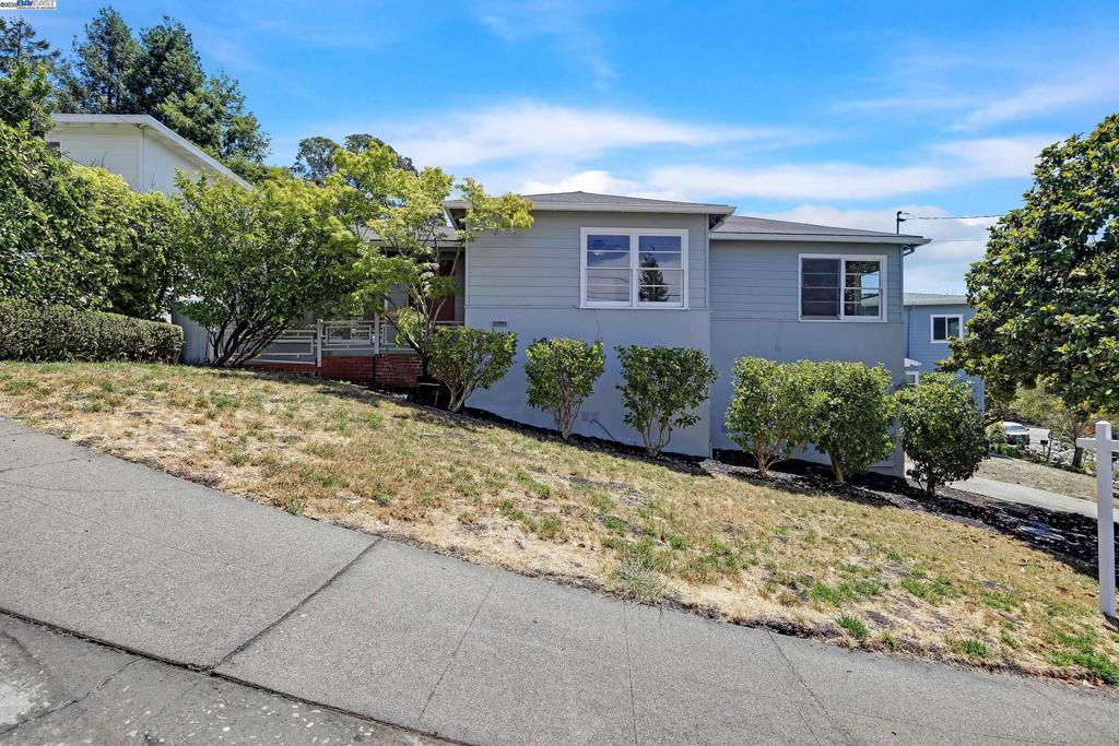 5040 Pierpoint Avenue is located near the top of a cul-de-sac in Oakland’s desirable Joaquin Miller neighborhood. Come with a vision! This 2 bedroom, 1.5 bathroom home has a Boxwood lined entry, views from several windows, neutral paint, and hardwood floors beneath carpet. The grand living room includes a formal dining area; the living room features a large window and several additional windows allowing an abundance of natural light to enter the room. The kitchen has a partial view of the bay from the sink and a door that leads to the rear yard where a small deck and tiered yard that can be transformed into a lovely space to garden, enjoy meals, and relax. The interior of the home has character. The bedrooms are spacious; each has two closets. The primary bathroom has a tub and large free standing shower. The laundry room with sink and additional .5 bathroom are located on the lower level. The garage is attached. This charming home is conveniently located within minutes of Joaquin Miller Park, Chabot Space Center, the shops and cafés of Woodminster and Montclair Village. This home's exceptional location offers convenient access to freeways and public transportation.