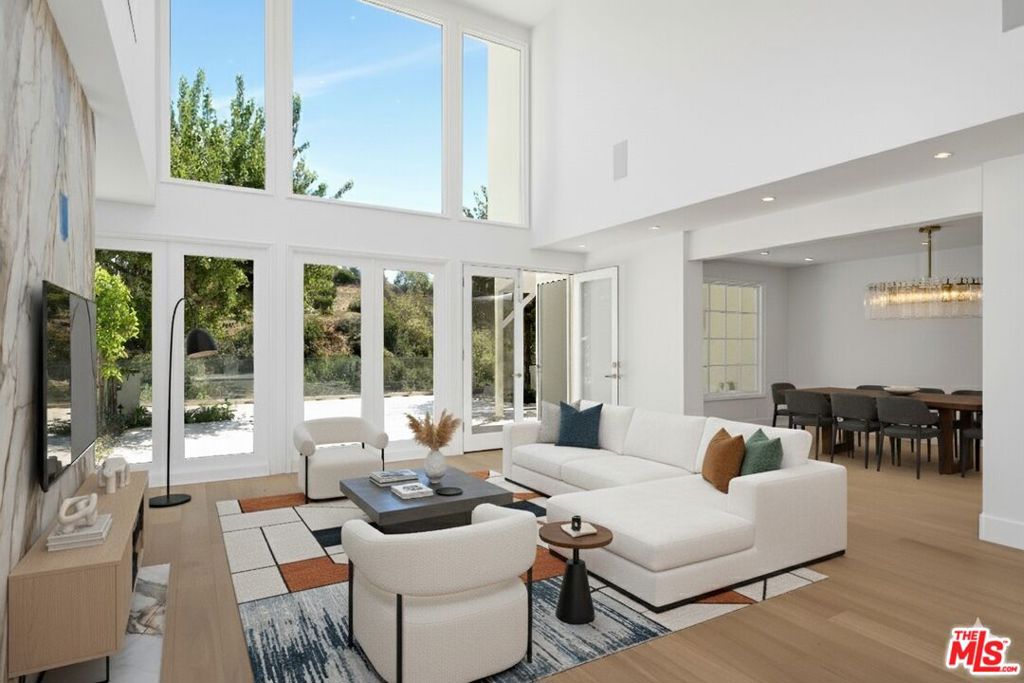 2205 Canyonback Road is a fully remodeled, three-bedroom, five-bathroom residence that also features a dedicated office and a versatile studio. The open-concept layout highlights soaring double-height ceilings in the living room, enhanced by expansive windows that flood the space with natural light and offer tranquil canyon and mountain views. The interior and exterior have been thoughtfully updated, including a stunning new kitchen, all-new bathrooms complete with a powder room on the main level and numerous upgraded systems throughout the home. Designed for both entertaining and everyday comfort, the spacious living and dining areas flow effortlessly to a private rear landscaped backyard. One en-suite bedroom is conveniently located on the main level, along with a flexible studio space featuring its own bathroom and direct access to the front patio, ideal for creative pursuits or peaceful reflection. Upstairs, two luxurious suites await, including a primary retreat with a spa-inspired bathroom, soaking tub, generous closet space, and a separate private office. This smart house has been designed by Alex Chen who designed Beverly Hills mansions. Two rooms have been added to the SQ Feet. Residents enjoy access to resort style amenities such as a community pool, spa, tennis courts, scenic hiking trails, and 24-hour security. The HOA provides comprehensive services including roof maintenance, exterior landscaping, barbecue areas, and full-time patrol along Canyonback Road.