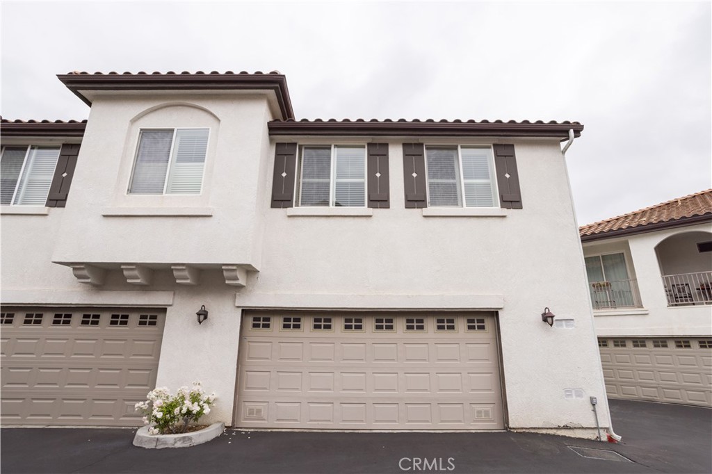Welcome to this turnkey, end-unit Solstice townhome in Canyon Country, built in 2010. This two-story home features two spacious bedrooms and two full bathrooms, including a convenient master suite upstairs. The open-concept main floor showcases a bright living area with wood and tile flooring, gleaming granite countertops in the kitchen, plus stainless steel appliances and a pantry. Sliding glass doors open onto a private balcony—perfect for your morning coffee or relaxing evenings. An attached two-car direct-access garage with laundry hookups adds extra convenience. This home includes central air conditioning and heater, and thoughtful interior touches like carpet in the bedrooms, laminate and tile in the common areas, and a breakfast counter/bar. Residents enjoy a community pool, spa, outdoor cooking area, and sidewalks in a suburban cul-de-sac. With proximity to shopping, dining, freeways, transit, parks, and top-rated schools, this gem is both comfortable and well-located.