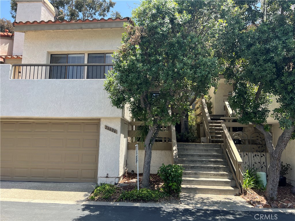 Newly renovated LA MANCHA Townhome. Well located near private Mission Viejo Country Club area in Mission Viejo! Spacious light and bright 3 bedroom (2 up and 1 down), 3 bath with soaring ceilings in the living room with custom fireplace. Main floor guest bedroom/office and upgraded hall bath. Also on the main level is the family room with dry bar, remodeled kitchen with upgraded stainless steel appliances, including refrigerator and quartz counter tops. Kitchen dining nook has access to the backyard patio. Upstairs are the two secondary bedroom that includes large primary suite with high ceilings, and private bath, two mirror wardrobe closets & ceiling fans. Main level features wood flooring with stairs and second level new carpets. New occupants will feel secure knowing that the plumbing has been replaced with PEX piping and newer furnace and air conditioning. Laundry room is downstairs with storage within the crawl space and direct access to the two car garage. La Mancha community features two community pools. This home has been well cared for, very clean and ready for occupancy. Fantastic community with expansive green belts. Convenient location to the 5 freeway, nearby shopping, parks & MV Country Club (private).