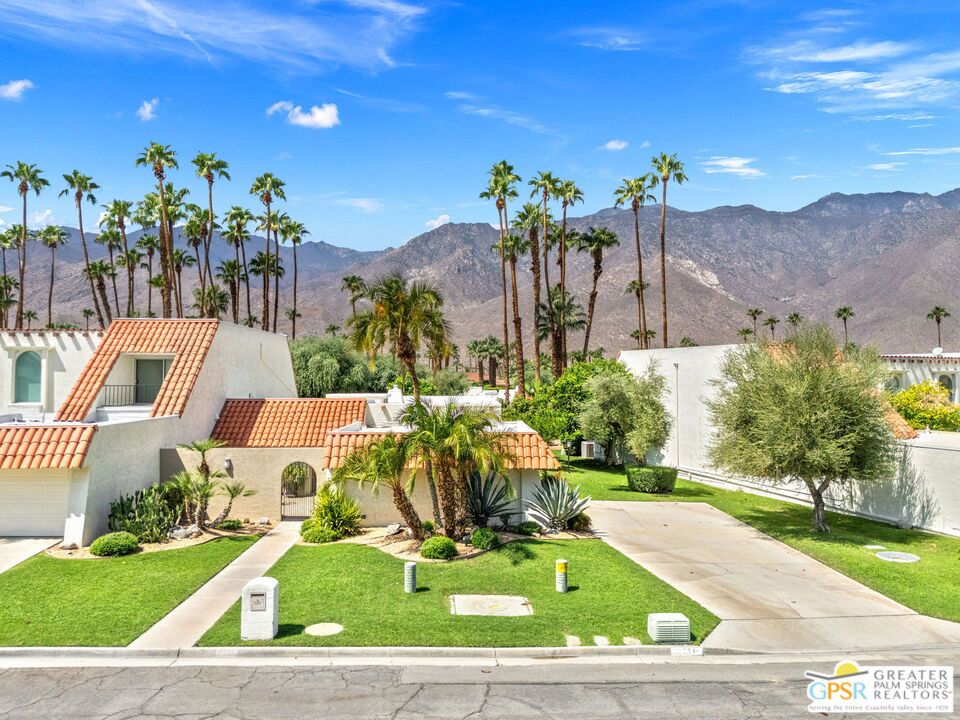 Surrounded by 360 of majestic mountain views, endless desert sky, and sunshine, this is one of the only 2 bed, 2 bath single-level condo that blends natural beauty with modern comfort. Just a short stroll to some of the best hiking trails in the Coachella Valley and minutes from downtown Palm Springs, you'll feel tucked away in your own desert retreat while staying close to all the action. Step inside and discover a bright open living space. The chef's kitchen, complete with sleek modern appliances, flows into an inviting dining area that's perfect for entertaining. The oversized primary suite showcases stunning mountain views, a large walk-in closet and a spa-like bathroom. A spacious guest room (currently styled as an office/den) adds flexibility for work or visitors as well as stunning mountain views towards the East. Enjoy quiet mornings in your private front courtyard, unwind in the lush back patio overlooking greenbelt lawns and soaring peaks, or start your day with a swim in the pool which is just steps from your patio. With an attached 2-car garage featuring plenty of storage and epoxy flooring, full laundry room and resort-style amenities including pool, spa, and tennis courts, this home is as practical as it is serene. This home is the only single story condo now available with beautiful views in Andreas Hills, call today for a private showing!