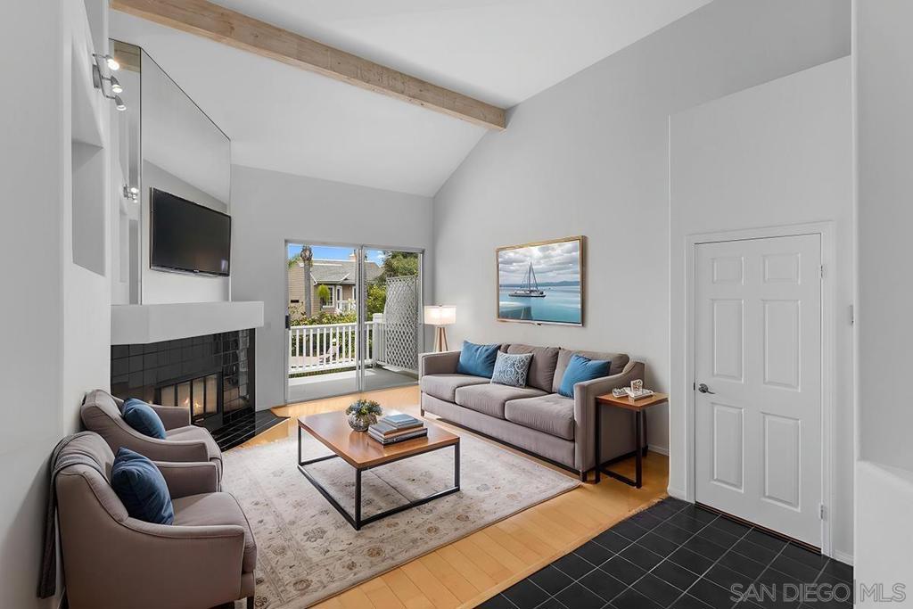 Live the La Jolla Lifestyle at Via Mallorca! Welcome to coastal comfort in this TOP-FLOOR bright and spacious 2 bed, 2 bath condo tucked into one of La Jolla’s most convenient communities. The open-concept layout features soaring vaulted ceilings, rich wood cabinetry, a stainless steel kitchen suite, and a dramatic living area with fireplace and access to a spacious balcony. Natural light floods through every corner(And skylights!), complemented by crisp lines, wood flooring, new carpet, new paint and a breezy indoor-outdoor flow. Retreat to a private primary suite with mirrored wall accents, high ceilings, and an oversized en-suite bath with dual vanities, soaking tub, walk-in shower, and generous closet space. Enjoy lush, resort-style amenities including a sparkling pool & spa, and peaceful water features surrounded by palms and tropical landscaping. Just minutes to Trader Joe’s, AMC theaters, Whole Foods, and the La Jolla Village Square — plus easy access to world-class beaches, La Jolla cove, UCSD, and the 5 freeway. Highlights: -2 spacious bedrooms, 2 full bathrooms. -2 car detached garage with extra room for storage for boards and E-bikes, etc..! -Vaulted ceilings, dramatic architectural details -Large kitchen with stainless steel appliances -Living room with fireplace & private balcony -Full size side-by-side laundry hookups -Community pool, spa, and lush landscaped grounds -Prime location near top-rated shopping, dining & beach life Don’t miss your chance to own a slice of La Jolla’s signature coastal charm!