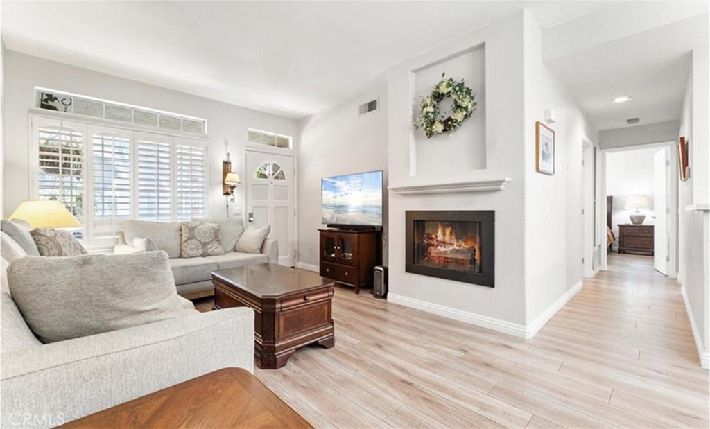 Spacious floorplan—this layout feels roomier than its size. This gorgeously remodeled 2-bedroom, 2-bathroom downstairs home in the highly desirable Belflora community of Rancho Santa Margarita is turnkey and brimming with upgrades. From the moment you step inside, you’ll appreciate the open, functional design, cozy fireplace, and abundant natural light. The gourmet kitchen is a showstopper—quartz counters, farmhouse sink, upgraded 5-burner stove, Samsung stainless steel smart appliances, and plenty of cabinetry for storage. Even the 4-door stainless refrigerator stays! Both bathrooms feature stylish barn-door shower enclosures and quartz counters, with the primary suite offering dual sinks and a spa-like feel. Bedrooms are generously sized, complete with custom shutters and ceiling fans.
Step out to your relaxing patio with a custom water feature—perfect for morning coffee, unwinding after work, or saying hello to friendly neighbors. The deep, attached 1-car garage with direct access adds everyday convenience. Located just steps from RSM Lake, you’ll enjoy iconic Saddleback Mountain views, lakefront dining, and serene walks. As a resident, you’ll have access to the Lago Santa Margarita Beach Club with its sandy beach lagoon, watercraft rentals, BBQ areas, volleyball, and more. The HOA also includes 13 parks, multiple pools, pickleball, tennis, sports courts, and community events year-round.
RSM has been ranked as a safest city in California—offering a walkable, active lifestyle with shops, restaurants, coffee houses, and parks all close by. Whether it’s kayaking on the lake, playing a quick game of pickleball, or relaxing at the beach club, every day feels like a getaway. And if you’re commuting, you’ll appreciate quick access to the 241 Toll Road and a short drive to the coast.
This isn’t just a smart find—it’s the home you’ll love calling your own! Come see why!