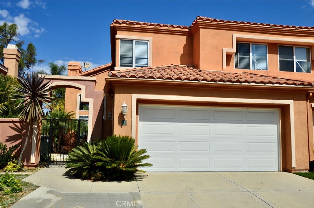 This Marina Hills, Monaco home Located at the end of a cul-de-sac is everything you've been looking for in a home. This large open floor plan with high ceilings and lots of light has been highly upgraded making this gorgeous home perfect for family and entertaining. The lower level features a fireplace in the living room, the formal dining room is adjacent to the kitchen with breakfast nook and half bath. Access the attached two car garage through the laundry room. Wood floors throughout take you to the upper level with three bedrooms and two baths. The master bedroom and bath feature ample closet space and double sinks. Panoramic views to enjoy from the upper and lower levels as well as the lushly landscaped, covered patio rear yard. Award winning schools at all grade levels, beach and harbor, numerous walking and biking trails, shopping and restaurants are all close by.