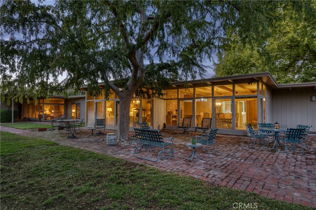 Dreaming of a home that makes a statement the moment you arrive? This is it. Welcome to 5646 E Park Circle Drive - a rare mid-century modern masterpiece designed by Harry Hunter, tucked away on a sprawling corner lot in one of Fresno’s most admired pockets.
For those who crave architectural character, natural light, and a lifestyle that feels anything but ordinary, this home delivers. Floor-to-ceiling windows erase the boundary between indoors and out, letting in sunlight, views, and a daily connection to nature that’s hard to find in the city.
Need space to spread out? You’ve got five spacious bedrooms, timeless design elements, and a layout that flows with ease. Whether you're hosting a lively gathering or carving out quiet moments of calm. Clean lines, original details, and craftsmanship that doesn’t come standard anymore make every room feel intentional and inspiring.
Want curb appeal with function? The circular drive welcomes guests in style. The backyard? It's your own private oasis, complete with room to entertain, relax, and even harvest from your very own pomegranate orchard.
If you’ve been waiting for that one home that checks all the boxes - style, space, serenity, and standout design - this is your chance to own a piece of Fresno's architectural soul.