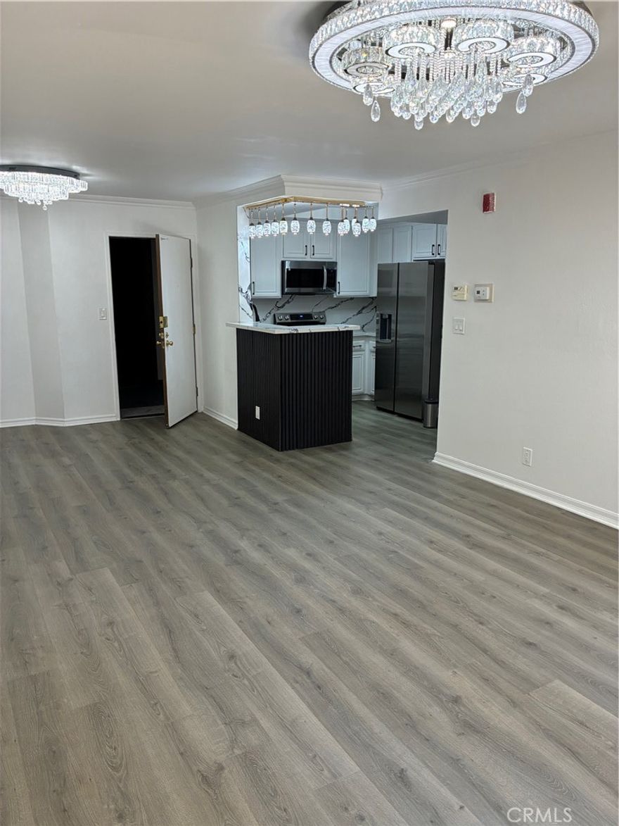 Welcome to an extraordinary opportunity to own a beautifully upgraded 2 bedroom, 2 bathroom corner unit condo in the heart of woodland hills' prestigious warner west community, with only one common wall. the kitchen features brand new appliances. luxurious lighting throughout the unit. This unit offers unmatched privacy, combining modern luxury with an enviable location. Enjoy your private balcony with a brand new floor overlooking the serene atrium and sparkling pool area. Gated parking and on site security provide peace of mind. 2 Side by side parking spaces with security camera and extra storage step away from the unit. Steps from Warner Center, enjoy upscale shopping at Westfield Topanga, dining along Ventura Boulevard, and outdoor recreation at Warner Ranch Park and Topanga State Park. With grocery stores and entertainment being within reach.