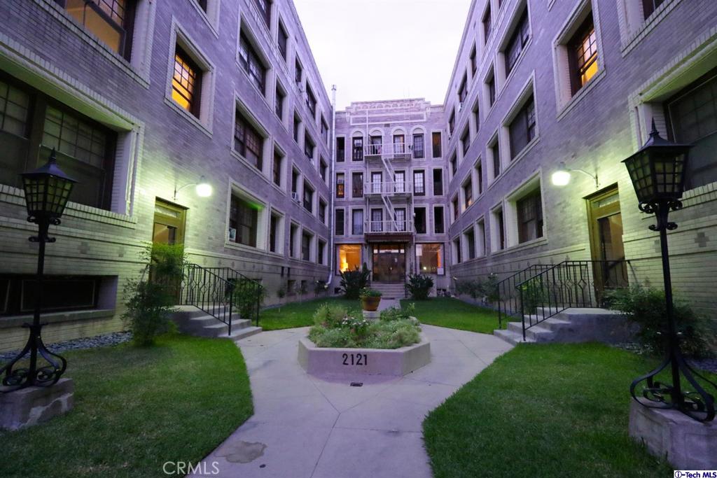 All utilities included in monthly Rent. Charming Remodeled 1-Bedroom in Historic Building – Prime Location Between Downtown LA & Mid-Wilshire. This beautifully remodeled 1-bedroom, 1-bath corner unit is located on the second floor of a historic building, offering the perfect blend of vintage charm and modern updates. With soaring 9-foot ceilings, Spanish-style tile flooring, and an abundance of natural light, this home has character and warmth.
The updated kitchen features custom cabinetry, ceramic countertops, and includes a refrigerator and stove. A small bonus room offers space for an office or extra storage. The bathroom boasts a walk-in shower, and the unit offers a peaceful city view.
Residents enjoy access to a secured courtyard entrance, an elevator, and multiple staircases. The building has been retrofitted for earthquake safety, ensuring peace of mind. The location couldn’t be more convenient: just three blocks from the Westlake/MacArthur Park Metro Red Line Station, and within walking distance to LA Live, Downtown, the Staples Center, FIDM, USC (1.5 miles), and Loyola Law School.
The home provider covers all utilities (except cable), including for amenities like free Wi-Fi in common areas, community laundry, a library, a piano, billiard and ping-pong tables, bike racks, and an exercise room. While there is no parking structure on-site, ample third-party parking options are nearby, with the closest lot located just 900 feet away at 942 S. Alvarado St. Perfect for a first-time homebuyer—make this charming unit yours today!
