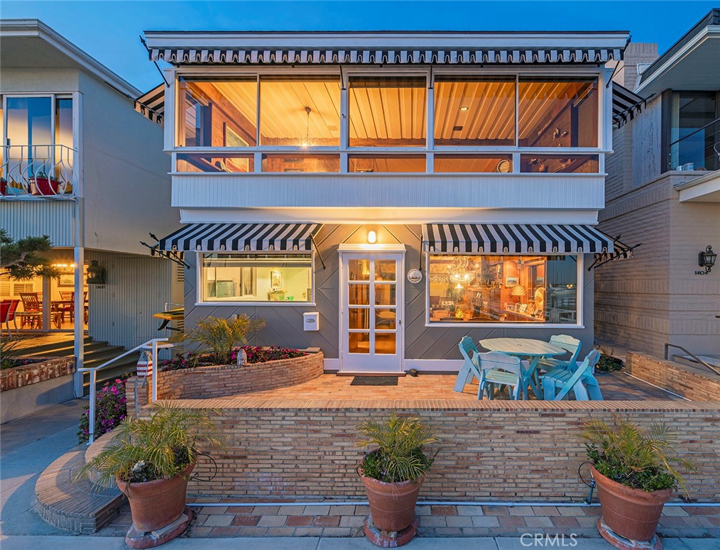 Available weekly, monthly or for a year. Delightful and full of character, 1402 South Bayfront is a stunning mid century custom home. It has expansive main channel views of Newport Harbor to the Pavilion. Downstairs features the kitchen and dining room which both overlook the harbor, a cozy family room with fireplace and adjoining atrium. Also on the lower level is bedroom with attached bathroom and access to a large two car garage. Take the grand staircase to the upper level where you'll find the master bedroom and two very warm guest rooms. On the second floor at the front of the home is a giant family room with fireplace, built in bookshelves and windows which span the width of the home for an even more spectacular view of the harbor. Enjoy your favorite beverage on the front patio and take in the scenery.
