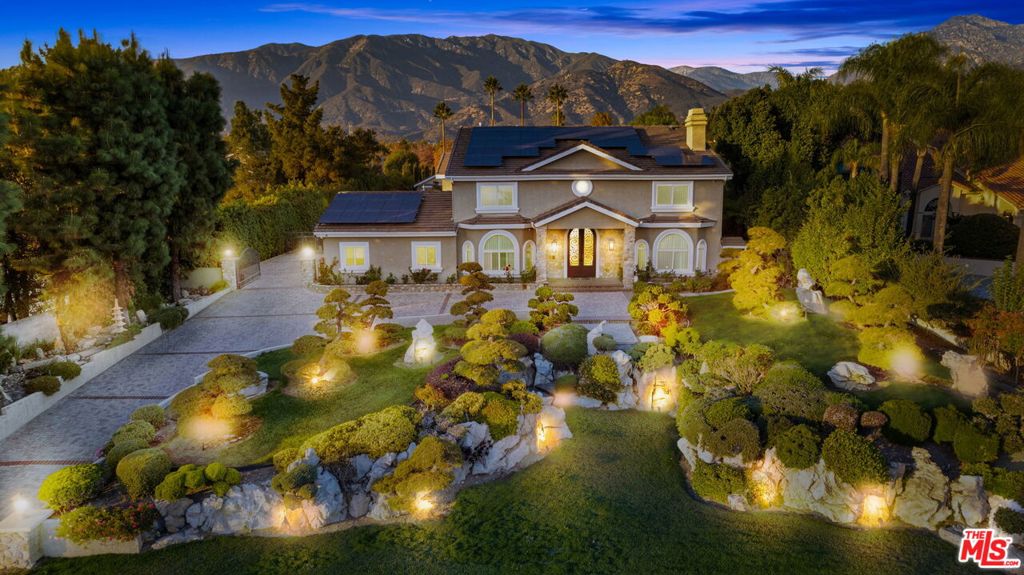 Claremont's Finest Property, a rare opportunity and unparalleled tennis court estate located in within the heart of the San Gabriel Valley on a very large 34,000 SF Lot. This extraordinary property has been meticulously renovated with some of the finest finishes and boasts Japanese gardens with harmonious landscaping, lightscaping which has been a labor of love for many years transforming it into a masterpiece estate. As you step inside, you'll be immediately captivated by the exquisite craftsmanship and thoughtful design having worked with a Feng Shui master all the elements just flow. The spacious kitchen and primary bedroom are designed to elevate both functionality and beauty, while custom-made cabinetry graces every room, seamlessly blending elegance with practicality. Upon entering the foyer, you'll find the dining room to your left, ideally positioned across from the stunning living room. Each area of the home, from the luxurious bathrooms to every living space, exudes a sense of tranquility and sophistocation. For the utmost peace of mind, a state-of-the-art 4K electronic surveillance system keeps the estate secure, allowing you to monitor the property remotely via your phone. The home also includes a Control4 smart home system, making it easy to manage lighting, entertainment, and climate across the main house, guest house, and even the tennis court. The expansive backyard is a private oasis, offering everything you could imagine for relaxation and recreation. A solar-powered, saltwater swimming pool, spa, waterfall, and waterslide await, as does a tranquil koi pond. The grounds are meticulously landscaped, drawing inspiration from asian botanical gardens, blending nature and design seamlessly. The LED-lit tennis court is perfect for evening matches, adding an extra layer of luxury to the property. At the rear of the estate, a fully permitted 785-square-foot guest house offers one bedroom, a bathroom, and a living room, kitchen and beautiful patio overlooking the gardens and tennis court. An ideal retreat for guests or extended family. The property is also equipped with an air-conditioned garage and a complete solar power system for added sustainability and efficiency. This estate represents a rare opportunity to own a property where modern luxury, serene landscapes, and cutting-edge technology converge to create a lifestyle like no other. Please call to schedule your private tour and experience the harmony and grandeur of 1047 Pomello Drive in person.