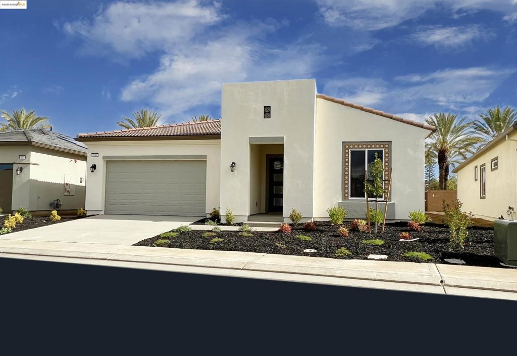 55+ COMMUNITY! Stunning Explore Model with nearly 1900 square feet of exquisite amenities and upgrades! One of the largest lots in this new subdivision with over 7000 square feet and a spacious rear yard with towering palm trees and no rear neighbors! Vaulted ceilings and endless upgrades including beautiful stone counters throughout and custom tile flooring! Custom carpeting in bedrooms. Large master suite & stunning bathroom with oversized walk-in closet! Ideal den/office with vaulted ceilings and bright windows. Spectacular 12-foot nano slider doors lead to large, covered patio! Oversized 2 car garage! Countless upgrades included! Stunning low maintenance side & rear desert landscape just completed!!