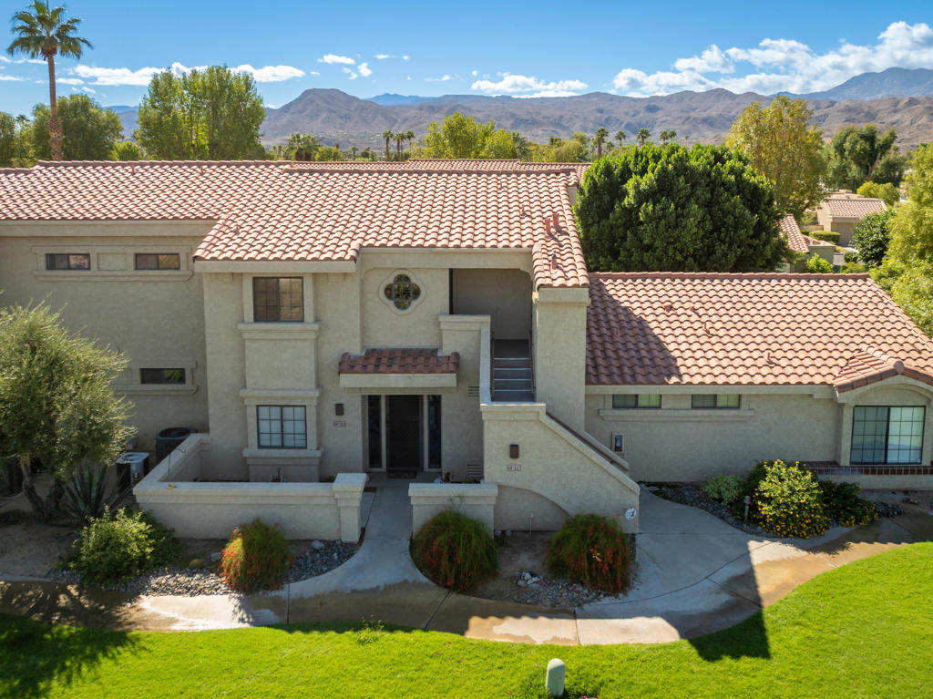 Enjoy the relaxed lifestyle that Cathedral Canyon Country Club has to offer in this 2 bedroom, 2 full bath condo. Located on the second floor, the spacious open floorplan with vaulted ceilings, creates a comfortable space for lounging or entertaining. The spacious primary bedroom opens out to the private balcony that has beautiful western views.  Both bedrooms have sizeable walk-in closets providing ample storage space. The washer and dryer are discreetly tucked away inside the unit. Tankless water heater was installed in 2024. Located close to shopping, restaurants, and much more! Ideal to enjoy full time, seasonal, or as a rental property. Start living your desert lifestyle today!