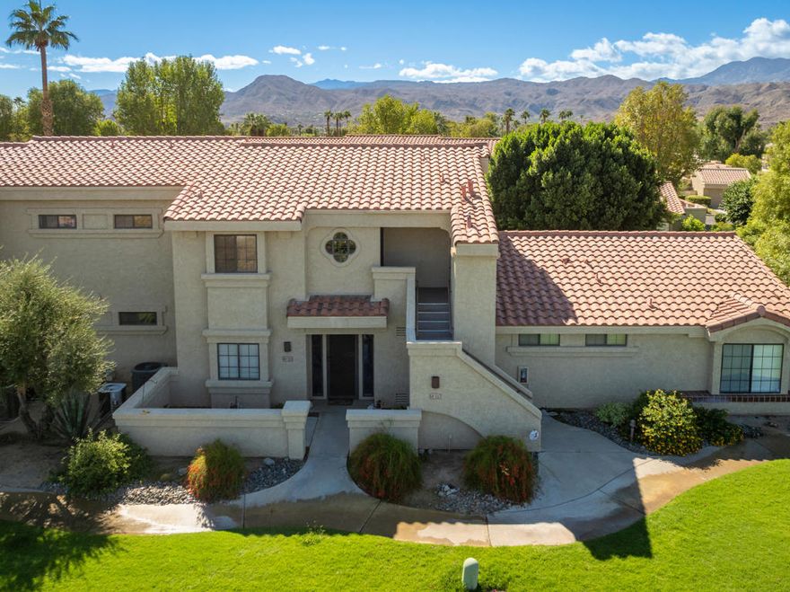 Enjoy the relaxed lifestyle that Cathedral Canyon Country Club has to offer in this 2 bedroom, 2 full bath condo. Located on the second floor, the spacious open floorplan with vaulted ceilings, creates a comfortable space for lounging or entertaining. The spacious primary bedroom opens out to the private balcony that has beautiful western views.  Both bedrooms have sizeable walk-in closets providing ample storage space. The washer and dryer are discreetly tucked away inside the unit. Tankless water heater was installed in 2024. Located close to shopping, restaurants, and much more! Ideal to enjoy full time, seasonal, or as a rental property. Start living your desert lifestyle today!