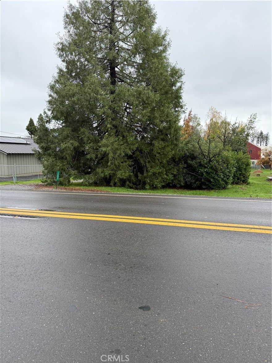 This wonderful flat lot sits towards the middle of town directly off of Bille Road near Sawmill Road, allowing for an easy commute to Chico or Oroville, and easy shopping within Paradise. The water meter is active, and per the Town of Paradise interactive maps, a 3 bedroom home is allowed. There are beautiful trees towards the front and back providing some privacy from the road and creating an appealing setting for a backyard. Build the home of your dreams on this lot and become a part of Paradise.