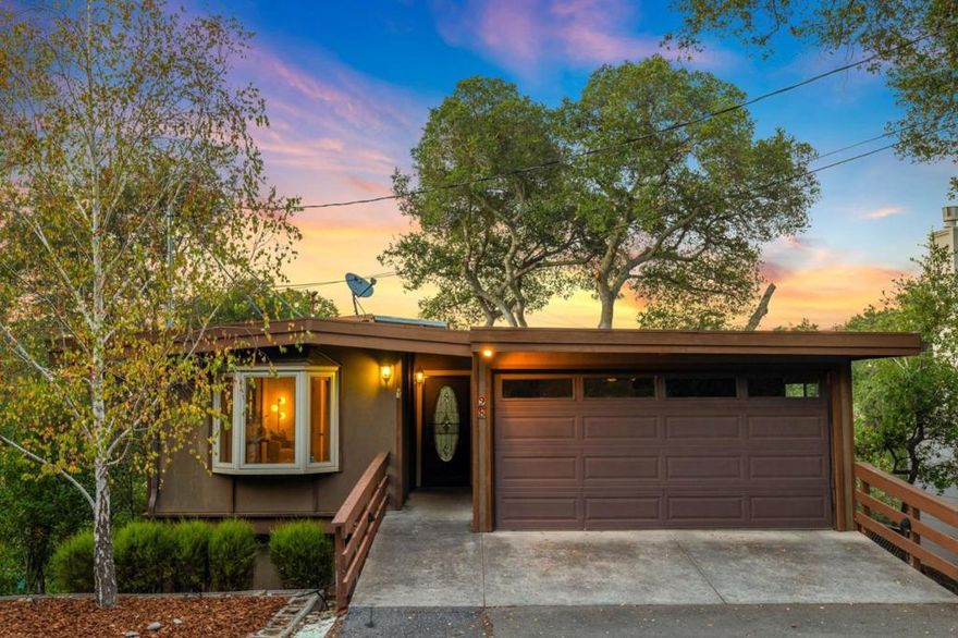 At the end of a peaceful dead-end street, this warm, inviting, and exquisitely unique property delights and surprises with architectural details and magical surroundings that invoke a far-away lodge retreat which, somehow, is mere minutes from downtown Los Gatos. Stunning architectural details include vaulted plank-and-beam ceilings throughout the open-concept first floor with its great room with wet bar, open kitchen with wrap-around eating bar and clerestory windows, and a sunken family room centered around a wood stove and surrounded by windows and sliding doors with direct access to the expansive back deck nestled among the trees. A bedroom with full bath and laundry room completes the main floor. On the lower level, two additional bedrooms share a breathtaking full bathroom with dual-sink vanity and a custom shower with an arched window overlooking the lower spa deck, plus direct deck access. This distinctive home will amaze and enchant you!