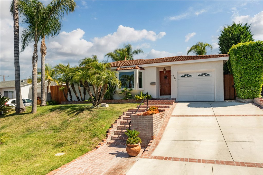 Welcome to a beautiful resort-like home perched on the sunny eastside of Rancho Palos Verdes! The fully remodeled ranch-style house blends timeless charm with modern luxury. With a classic red tile roof and beautiful curb appeal, this move-in ready property offers a lifestyle of comfort and convenience in one of the Peninsula’s most accessible locations.
Inside, the home showcases a thoughtfully redesigned interior. The newly-remodeled contemporary kitchen is equipped with Bosch appliances, and includes custom cabinetry with walnut floating shelves and Montblanc quartzite countertops. The open living area is bright and welcoming, with a new sliding patio door that brings the outdoors in, recessed lighting, ceiling fans, a charming front bay window and elegant oak hardwood floors throughout.
Step outside to your own private paradise perfectly landscaped with lush greenery, butterfly garden, palm trees, red brick pavers set on rebar-supported foundation, gorgeous oak fence and a custom in-ground saltwater pool and spa. Whether you are entertaining or enjoying a peaceful evening at home, this space offers true year-round resort style living.
Located in the award-winning Palos Verdes Peninsula Unified School District, and just minutes from shopping, dining, and easy freeway access, this home also offers both partial city lights views and the kind of quiet, comfortable living that’s hard to find.
Don’t miss your chance to call this charming home yours - schedule a private tour today!