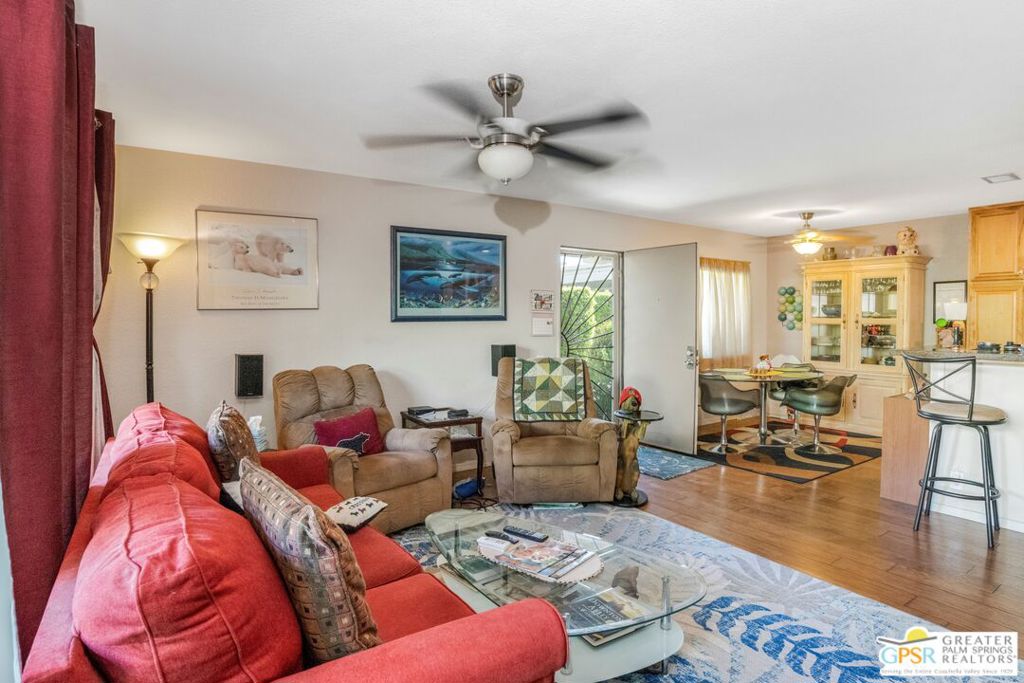 Discover the essence of Palm Springs living in this charming 2-bedroom, 2-bathroom condo located at the highly sought-after Ramona Villas, a gated community designed by renowned architect Barry Berkus, in the heart of Palm Springs. This single-level, 1,069 sq. ft. residence, built in 1980, offers a perfect blend of comfort and convenience. Step inside to a thoughtfully designed open-concept great room, where walls were removed in the kitchen to create a spacious and inviting feel. The kitchen features sleek stainless steel appliances. Enjoy the added convenience of in-unit laundry. The unit boasts a private patio, providing a secluded outdoor retreat perfect for relaxing or entertaining while enjoying the beautiful Palm Springs ambiance. This property can convey furnished per inventory. Enjoy the incredible amenities that Ramona Villas offers, including a sparkling saltwater swimming pool, spa, fitness center, clubhouse, tennis/pickleball courts, and convenient EV charging stations. The HOA fee of $463 per month covers essential services such as roof maintenance, earthquake insurance, water, and trash, ensuring a hassle-free lifestyle. This condo includes one covered carport parking space and additional storage options conveniently located within the complex. Situated on fee simple land (you own the land) and just minutes from vibrant downtown Palm Springs, you'll have easy access to world-class dining, shopping, galleries, and entertainment. Don't miss this opportunity to own a piece of paradise in Palm Springs!
