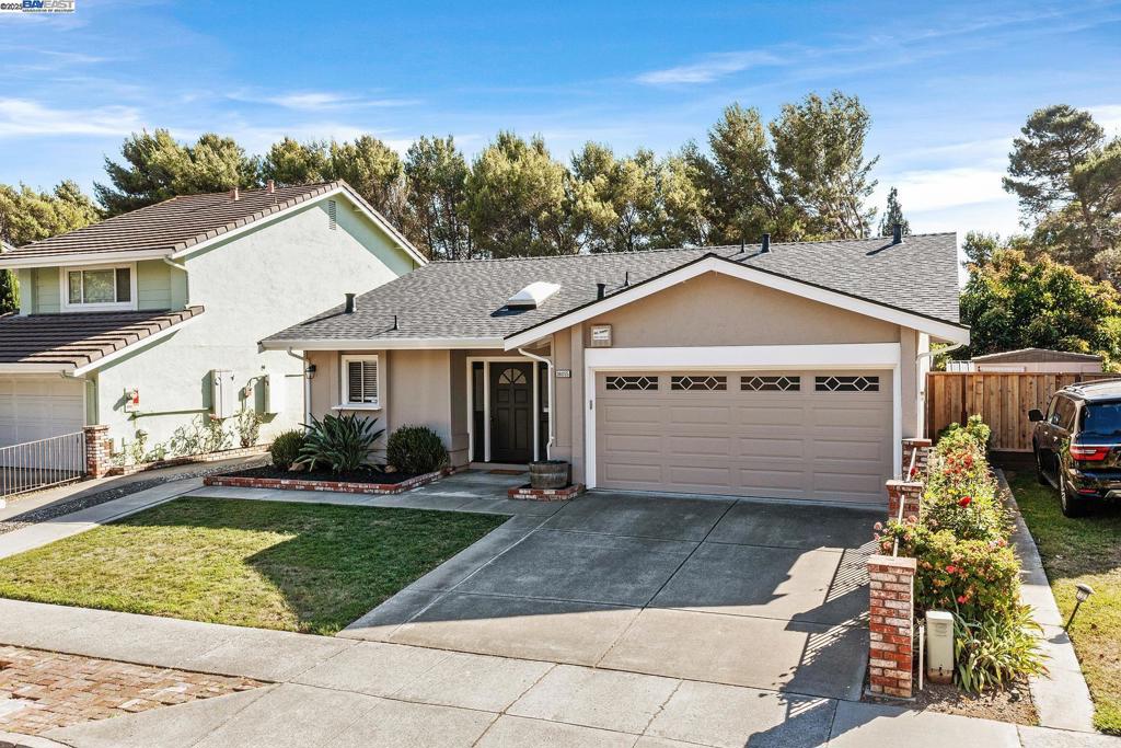 Don't miss this rare opportunity to buy two parcels included with this lovely updated home with attached 2 car garage and a separate driveway to the back yard. The second parcel has a large garage with electricity & water (maybe an ADU?). The main home has a large kitchen with beautiful granite counter tops and stainless steel appliances. Laminate floors throughout with tile in the bathrooms. The primary bedroom has an updated bath and plenty of light. Home feels larger than its square feet. Living room has gas fireplace insert and a slider to back covered patio, double gated side yard access for RV and all your toys. Brand New Roof installed 7/30/25. Home has great insulation & feels cool on hot days. The home is loved and well cared for. Don't miss this property that is in move-in condition. Both lots equal 9,735 sq ft. Open house 8/3, 10-2 PM