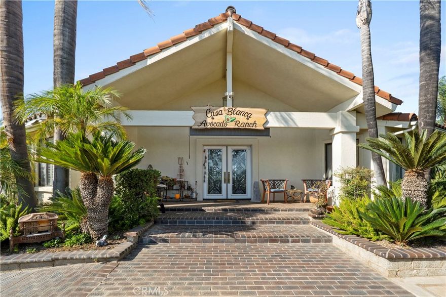 Welcome to Casa Blanca Avocado Ranch. This remarkable 7-acre estate offers endless possibilities. Main residence offers over 3,000 sqft living space with 4 bedrooms, 3 bathrooms, an office, family room, den, wet bar, and a 3 car attached garage the backyard has a beautiful  private pool. The property also includes a 1 bedroom, 1 bathroom guest house with in-unit laundry and an attached workshop. 

A 6,000 sqft industrial warehouse is constructed with fully insulated steel,200 amp 3-phase power, large bridge crane to lift and move heavy equipment and machinery, equipped with built-in custom air compressors, there are three 16ftX14ft drive-in roll up doors, provides possible business use or leasing income. Not only is this warehouse huge, it also provides an extra 3,000sqft uncovered patio located at the rear of the structure, whic can be used for extra storage or parking. Both warehouse or work shop can be used to host grand events such as weddings, sweet 15's or conferences. Inside the massive warehouse, you'll find a conference room, office, file room, small bedroom and 1 bathroom with a walk-in shower. The warehouse driveway offers parking for approximately 10-15 cars, large trucks and/or trailers. With more than 350 avocado trees and other fruit trees, this property combines residential living, agricultural production and investment opportunity. Feel free to look at the 3D tour!!