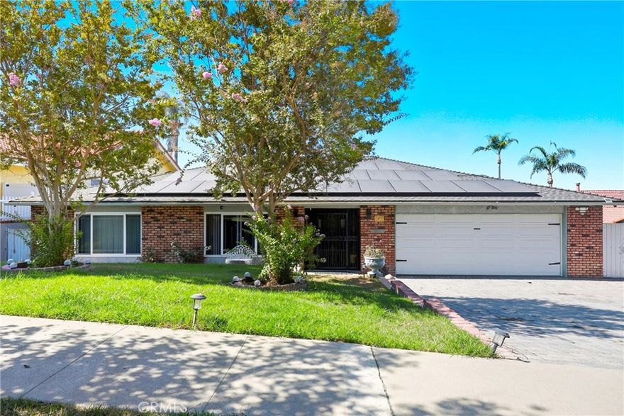 Welcome to your private oasis in the highly sought-after Country Club Estates of Corona. This beautifully upgraded 4-bedroom, 3-bath custom home is situated on a large lot with no rear neighbors, offering the ultimate in privacy and tranquility. The thoughtfully updated interior showcases elegant finishes including marble countertops, glass mosaic backsplash, and ample cabinetry in the spacious gourmet kitchen. The expansive living room features a built-in bar and marble fireplace, while multiple sliding glass doors frame picturesque backyard views. Designed with entertaining in mind, the outdoor space includes a sparkling pool, spa, firepit, built-in BBQ, and expansive deck—perfect for gatherings. An elevated sport court provides panoramic views and the lower garden level offers peaceful nature walk access, waterfall feature, and space for gardening. Additional highlights include a wide side yard with space for a boat or trailer, fruit trees, and regular visits from local wildlife. This is a rare opportunity to own a turnkey retreat that feels like a private resort.