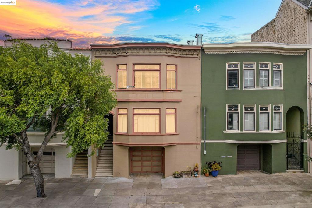 Experience the rare opportunity to live, rent, and build real wealth in this expansive 3,732 sq ft duplex in the heart of Outer Richmond—one of San Francisco’s most iconic neighborhoods. This gem features two spacious, tenant-occupied units on the top and middle floors, each offering identical floor plans with two beds, one bath, a living room with fireplace, a dining room, a sun room, a kitchen, and access to the shared backyard. On the ground floor, a bonus 2-bed, 1-bath studio is move-in ready—ideal for house hacking, multigenerational living, or creating your city pied-à-terre. Inside, natural light floods the living spaces that flow seamlessly from room to room, combining vintage character with modern comfort. Both upper units feature sweeping downtown views of San Francisco, with one including an additional den/home office. Additional highlights include a 2-car tandem garage with ample storage, a private fenced backyard for relaxing, and an unbeatable location near parks, trails, and everyday conveniences. Enjoy direct transit access to downtown, and proximity to the Presidio, Legion of Honor, Land’s End, Sutro Baths, Ocean Beach, and the vibrant Richmond Village corridor. Golden Gate Park, Andronico’s, and Golden Gate Bridge views are just minutes away.