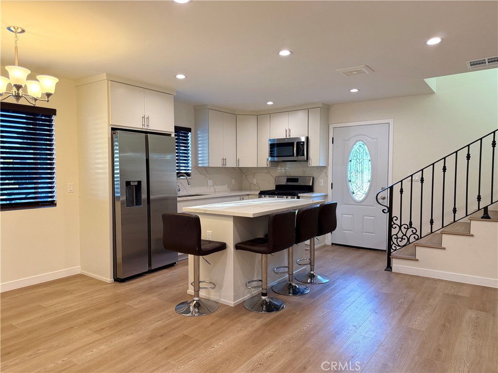 Be the first to live in this stunning brand-new 2-bedroom, 2-bath ADU located in a prime Woodland Hills neighborhood! This beautifully designed home features an open-concept layout with a spacious kitchen island, custom cabinetry, and high-end finishes throughout. The interior boasts neutral tones and designer details, creating a clean, modern aesthetic that complements any style. Enjoy the comfort of central air and heat, in-unit washer and dryer, and ample storage. Step outside to your own private yard, perfect for relaxing or entertaining. With thoughtful design and a prime location close to shops, hospitals, dining, and freeway access, this ADU offers both comfort and convenience. Don’t miss it!