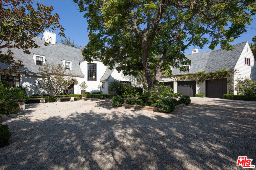 Sprawling Traditional Estate poised on over an acre of very pvt, tree-filled grounds w/ dramatic views in the heart of BW. With 3 distinct structures including large scale main hse, gst hse, recording studio, separate gym and pool pavilion, all set amidst gorgeous gardens and towering trees, this magical property just underwent a complete top to bottom renovation with no expense spared. Classic architecture, extraordinary finishes & detailing & ideal flr plan w/ every imaginable space & amenity. Formal entry w/ FP & dramatic spiral stair leads to grand-scale living room, FDR, stunning cooks kitch, fam rm & game rm. There are 6 bedroom stes in the main hse incl a fabulous master w/ sitting room, FP, lavish bath, 2 walk-ins, and a dressing rm/office. The breathtaking grounds include a large gated motor court, entertaining patios, expansive lawn, rose/vegetable gardens, championship tennis court & hotel-size swimmers pool. A truly rare offering in most desirable Brentwood location.