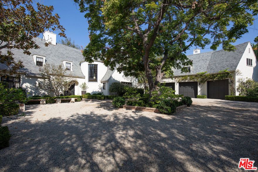 Sprawling Traditional Estate poised on over an acre of very pvt, tree-filled grounds w/ dramatic views in the heart of BW. With 3 distinct structures including large scale main hse, gst hse, recording studio, separate gym and pool pavilion, all set amidst gorgeous gardens and towering trees, this magical property just underwent a complete top to bottom renovation with no expense spared. Classic architecture, extraordinary finishes & detailing & ideal flr plan w/ every imaginable space & amenity. Formal entry w/ FP & dramatic spiral stair leads to grand-scale living room, FDR, stunning cooks kitch, fam rm & game rm. There are 6 bedroom stes in the main hse incl a fabulous master w/ sitting room, FP, lavish bath, 2 walk-ins, and a dressing rm/office. The breathtaking grounds include a large gated motor court, entertaining patios, expansive lawn, rose/vegetable gardens, championship tennis court &  hotel-size swimmers pool. A truly rare offering in most desirable Brentwood location.